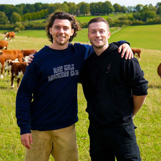 Andy Smith and Niall Kiddle in cow field