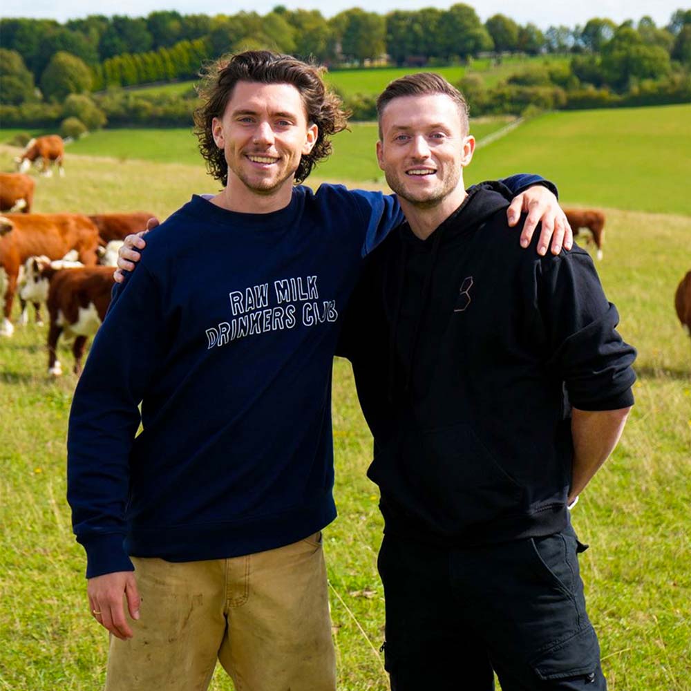 Andy Smith and Niall Kiddle in cow field