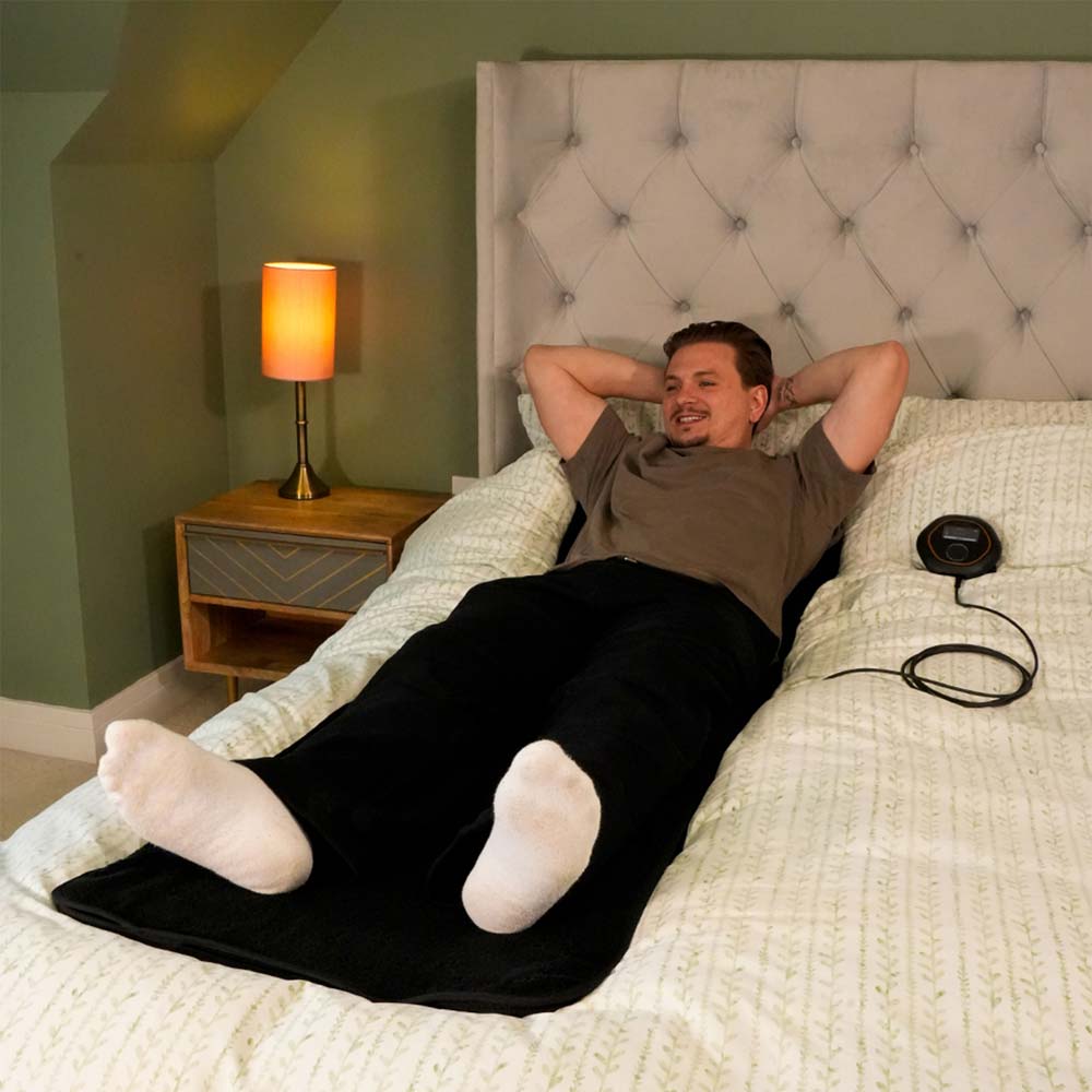 Women laying on CELLER8 full body mat on sofa