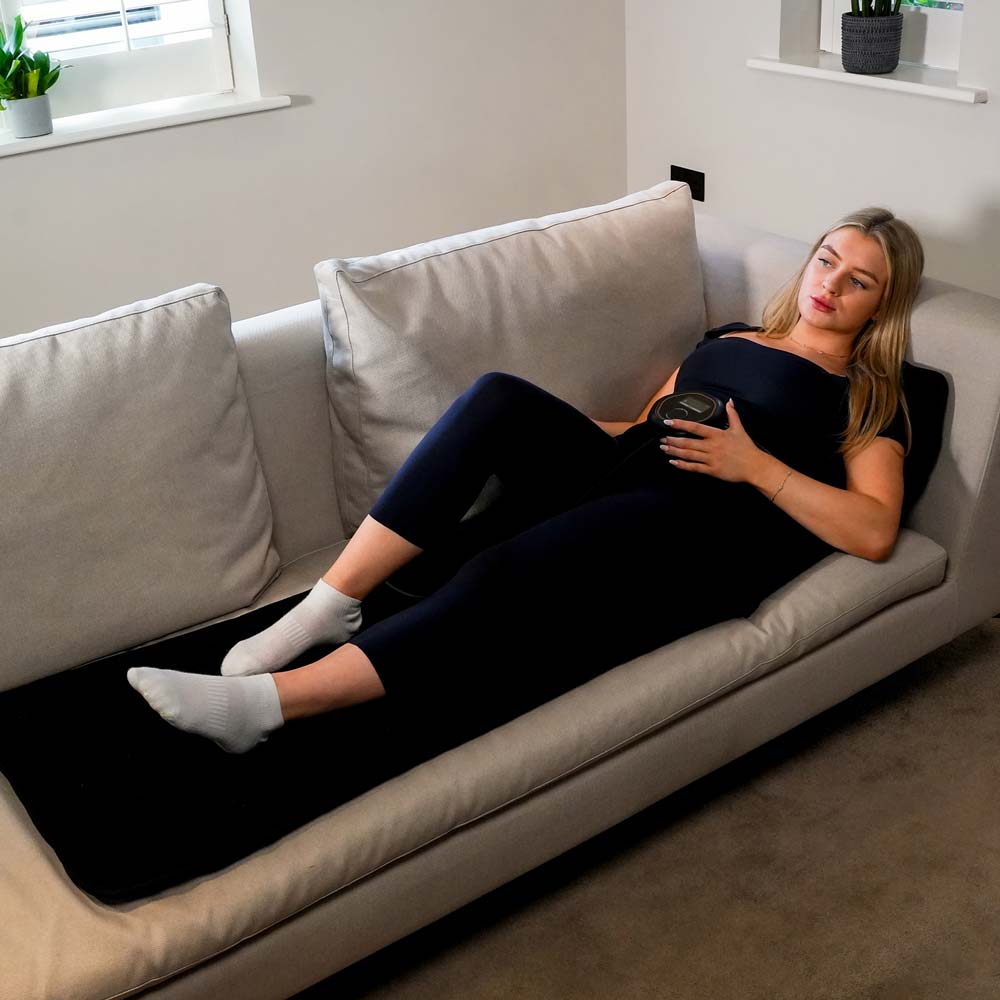 CELLER8 full body mat being used on a sofa with CELLER8 around waist