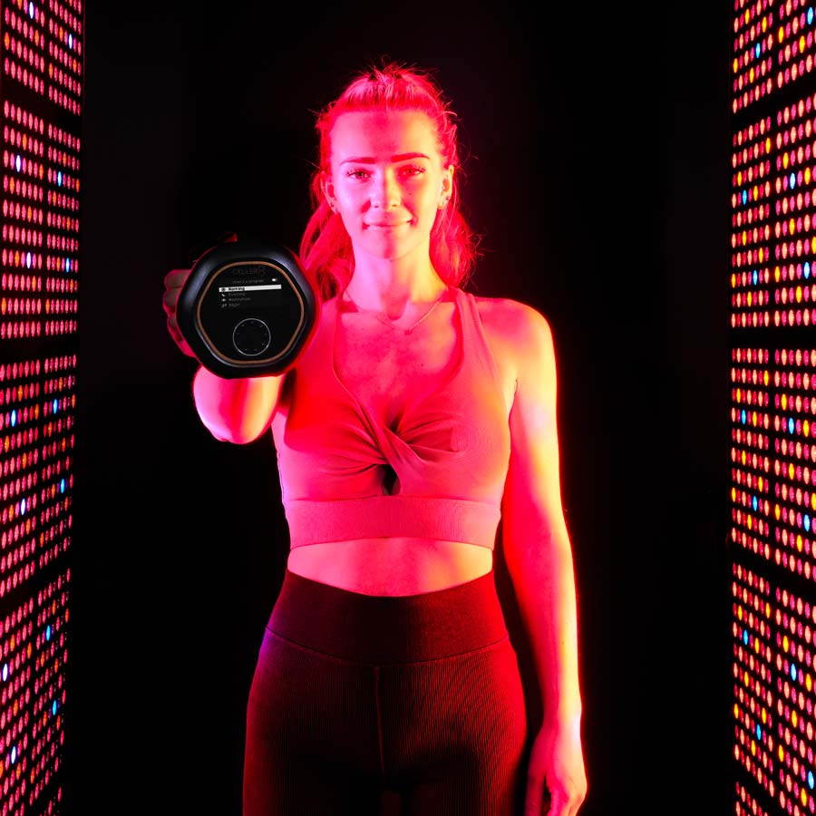 lady stood between panels holding CELLER8