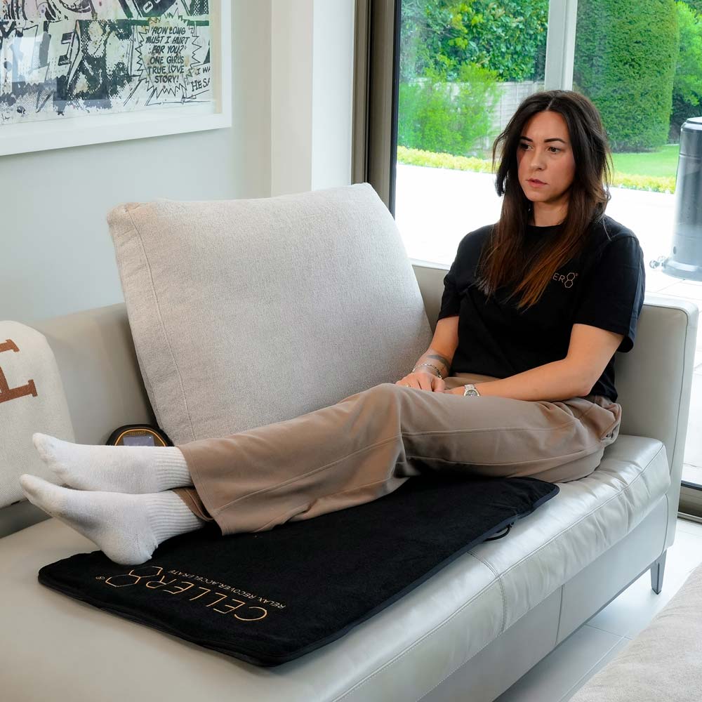 Women laying on CELLER8 full body mat on sofa