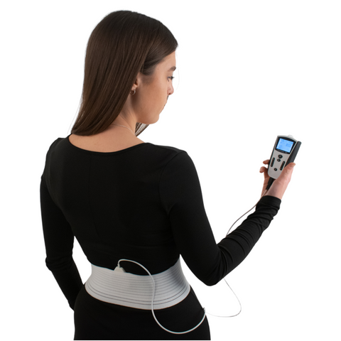 FlexPulse Gen 2 PEMF device being applied to lower back